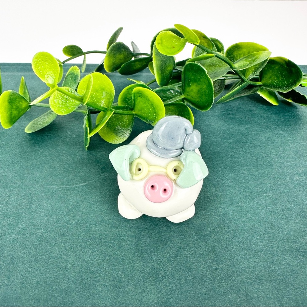 Vintage Mini Pig Figurine wearing sleeping cap